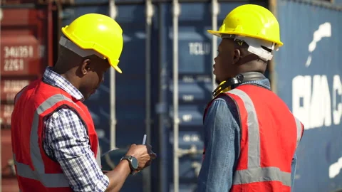 Group of two african american engineer  holding tablet  computer talking wi.. Stock Footage 242308630