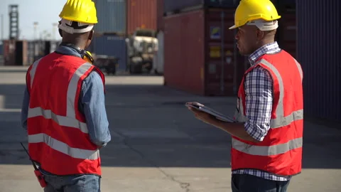 Group of two african american engineer  holding tablet  computer talking wi.. Stock Footage 242309245