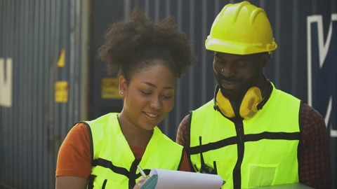 Group of two african american  engineer man and inspector woman talking wit.. Stock Footage 248348751