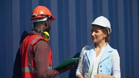 Group of two african american  engineer man and inspector Caucasian woman t.. Stock Footage 248361348