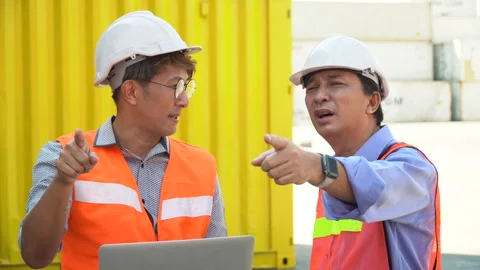 Group of two asian engineer holding laptop computer talking with colleague .. Video stock 241719833