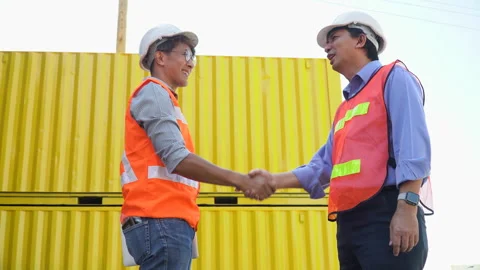 Group of two asian engineer holding laptop computer shaking hands with coll.. Stock Footage 241720304