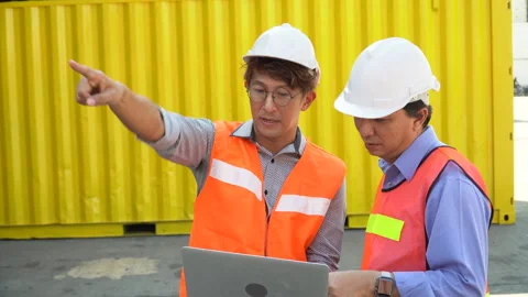 Group of two asian engineer holding laptop computer talking with colleague .. Video stock 241720326