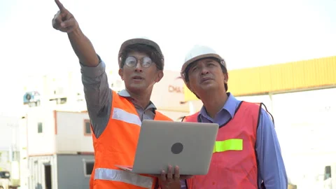 Group of two asian engineer holding laptop computer talking with colleague .. Stock Footage 241725326