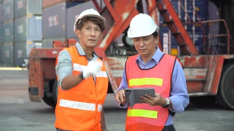 Group of two asian engineer holding laptop computer talking with colleague .. Stock Footage 242310424