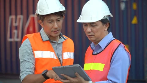 Group of two asian engineer holding laptop computer talking with colleague .. Stock Footage 242313856