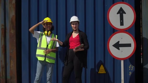 Group of two diversity woman container worker working together with tablet .. Stock Footage 248359262