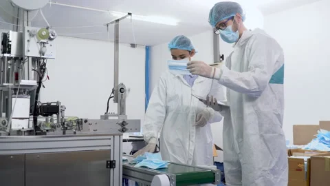Group of two inspector worker wearing ppe suite, face protective mask and glo Stock Footage 141409132