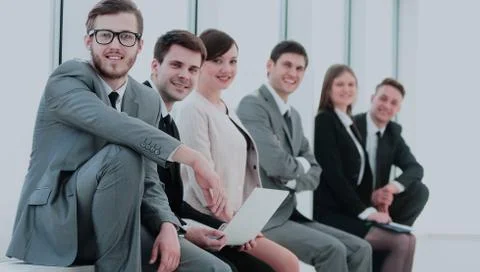 Group of University students sitting on the windowsill in the lo Stock Photos
