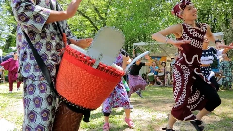 Group of unknown dancers dancing African dances at summer festival. Stock Footage 107993841