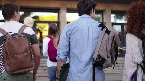 Group of unrecognizable students seen with their backs turned Stock Footage 268237055