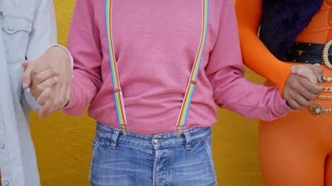 Group of unrecognizable young people together on gay pride parade day. Yellow Stock Footage 240755180