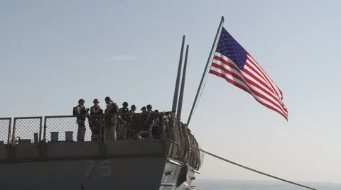Group of US marines stands on the deck of missile destroyer Stock Footage 54318374