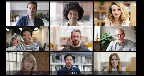 Group Using Video Conferencing technology in office for video call with Video stock 127036131