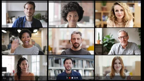 Group Using Video Conferencing technology in office for video call with Video stock 127036374