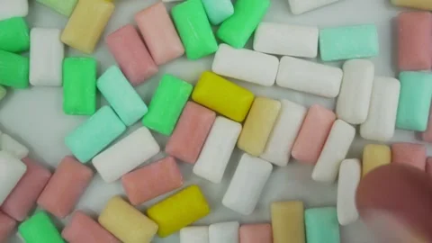 Group of variety bubble gums with fruit and mint filling fallen on table 動画素材 169872036