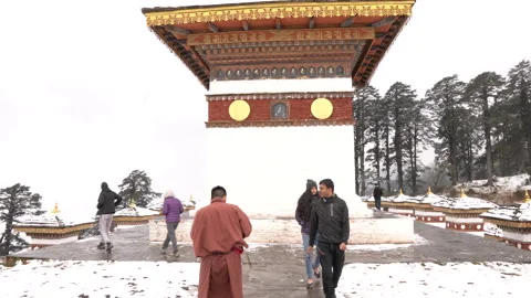 A group of visitors walking at the Dochula Pass in Bhutan Stock Footage 220457970