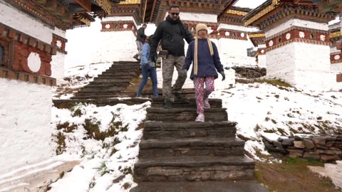 A group of visitors walking at the Dochula Pass in Bhutan Stock Footage 220458300