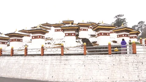 A group of visitors walking at the Dochula Pass in Bhutan Stock Footage 220458340