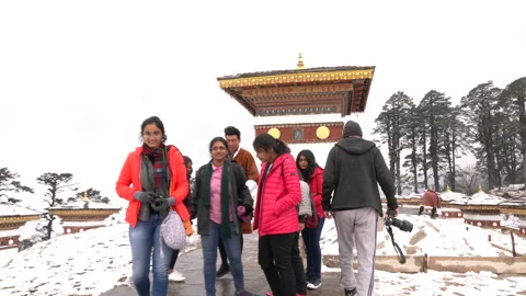 A group of visitors walking at the Dochula Pass in Bhutan Stock Footage 220458358