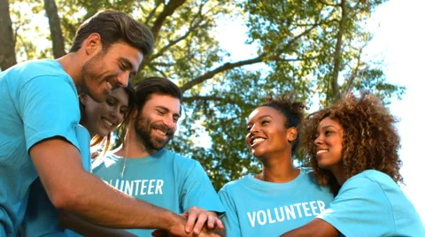 Group of volunteer forming hands stack Stock Footage 68945475