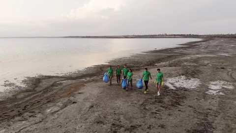 A group of volunteers colect garbage Stockbeeldmateriaal 125284428