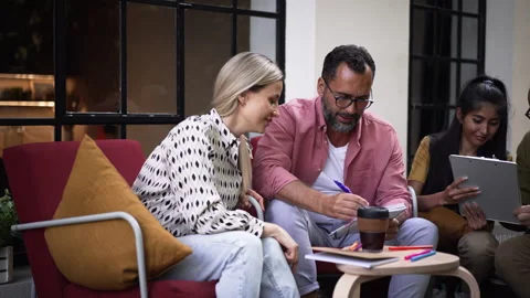 Group of volunteers planning charitable work in their community space. Stock Footage 259888045