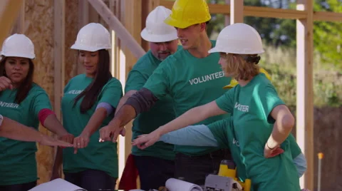 Group of volunteers working together on construction project Stock Footage 47540284