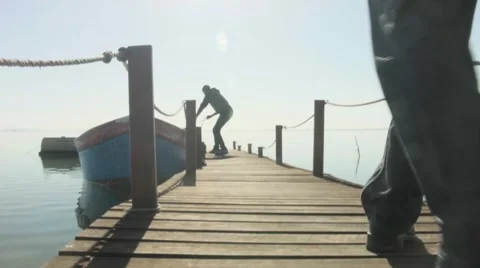 A Group Walking on the tiny marine bridge Stockbeeldmateriaal 62402767