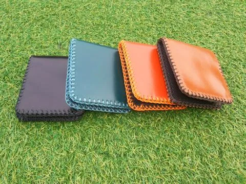 Group Wallets on grass Stock Photos