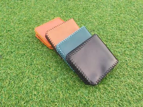 Group Wallets on grass Stock Photos