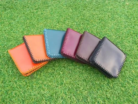 Group Wallets on grass Stock Photos