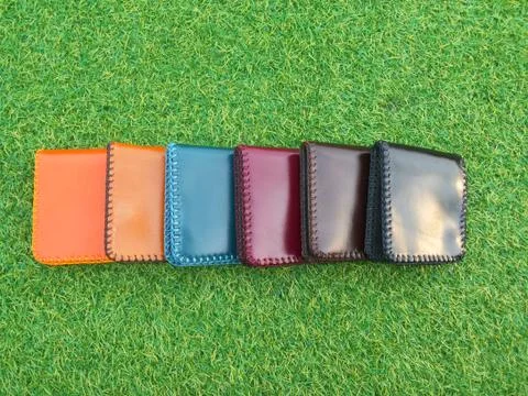 Group Wallets on grass Stock Photos