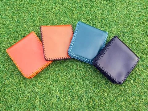 Group Wallets on grass Stock Photos