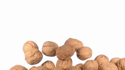 Group of walnuts flying in slow motion Stock Footage 118702402