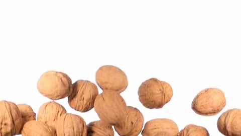 Group of walnuts flying in slow motion Stock Footage 118702407