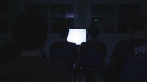 GROUP WATCHING TV SCREEN Stock Footage 27997774