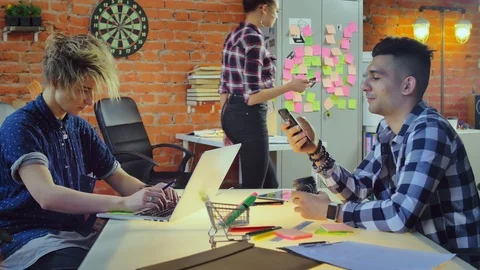 Group web designers actively working in creative office modern company Stock Footage 90470428