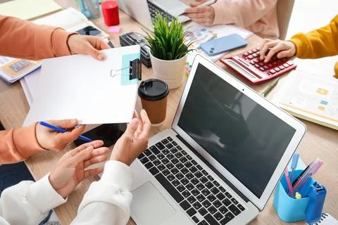 Group of web designers working at desk in office Stock Photos