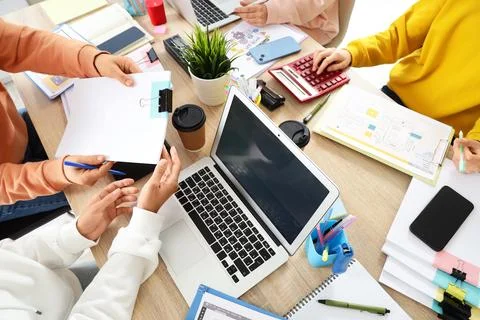 Group of web designers working at desk in office, top view Stock Photos