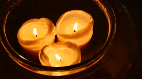 Group of white burning candles on a table Stock-Footage 59572800