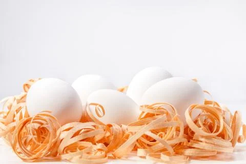 A group of white Easter eggs in a saw Stock Photos