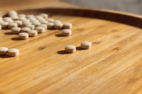 Group of white pills on the table Stock Photos