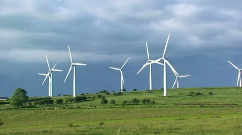 Group of wind mills in front of a dark cloud Video stock 39994354