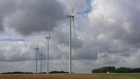 Group Of Wind Turbines In A Field On A Cloudy Summer Day Stock Footage 308894393