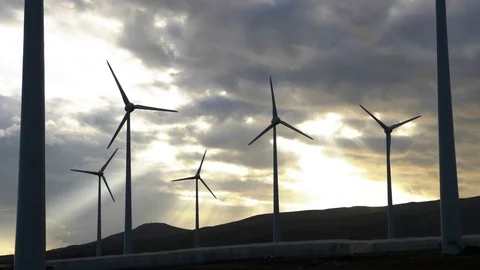 A group of wind turbines with godrays. Stock Footage 97463419