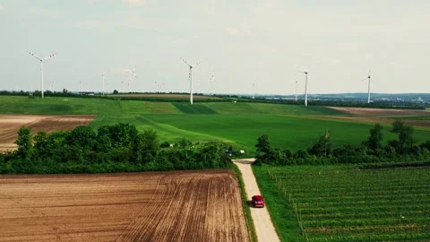 Group of wind turbines on wind farm mountain field Stockbeeldmateriaal 243203290