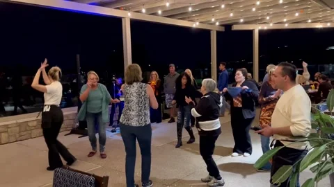 Group of women having fun dancing on restaurant patio. Stock Footage 252231597