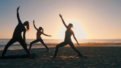 Group Of Women Practicing Yoga Stock Footage 77585469