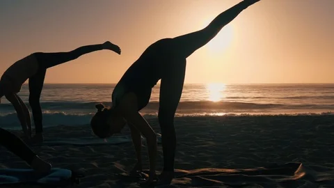 Group Of Women Practicing Yoga Stock-Footage 77585471